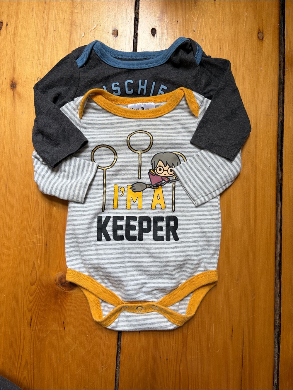 Pair of Harry Potter Onesies “I’m a keeper” and “mischief managed”